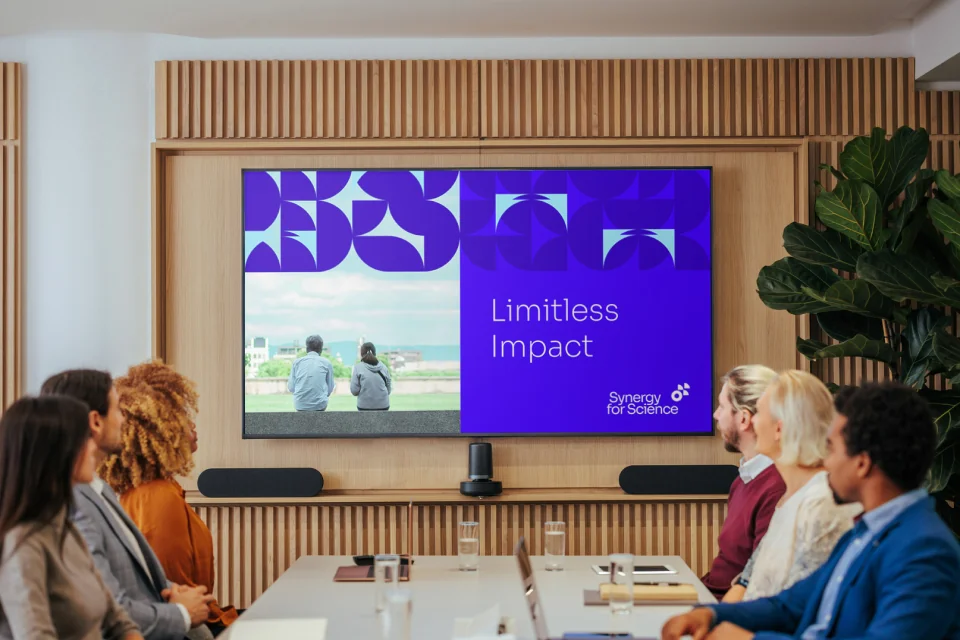 A Sköna-designed presentation on a conference room screen